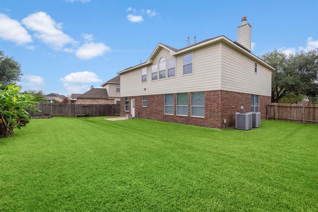 Spacious fenced backyard with plenty of space for future pool or whatever you have in mind for outdoor activities. | Image 33