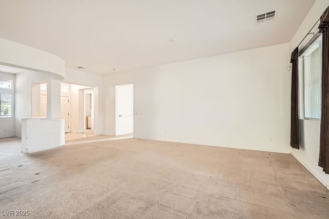 Empty room featuring visible vents and light carpet | Image 6