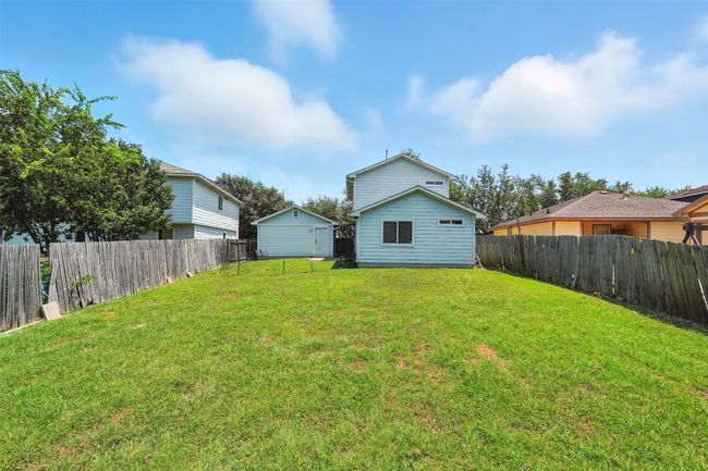Rear view of house featuring a fenced backyard | Image 25