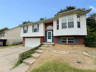 Raised ranch featuring a garage | Image 3