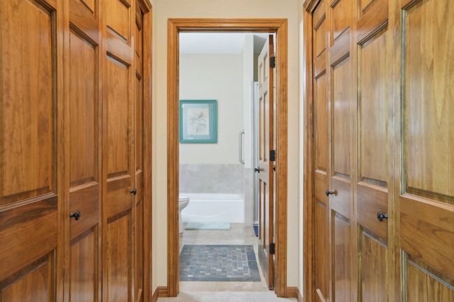 Hallway featuring tile patterned floors | Image 13