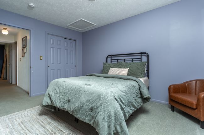 bedroom with carpet floors, attic access, and a closet | Image 20