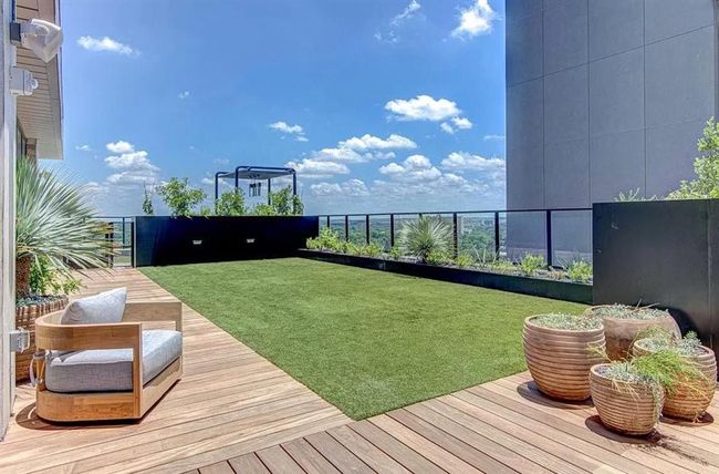 View of grassy yard featuring a balcony | Image 28