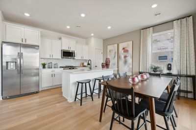 (Photo of decorated model) This spacious and open main level seamlessly connects to the kitchen area, perfect for entertaining. | Image 1