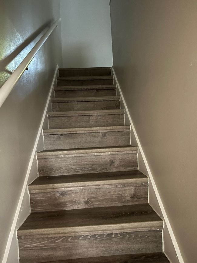 Stairs featuring wood finished floors | Image 14