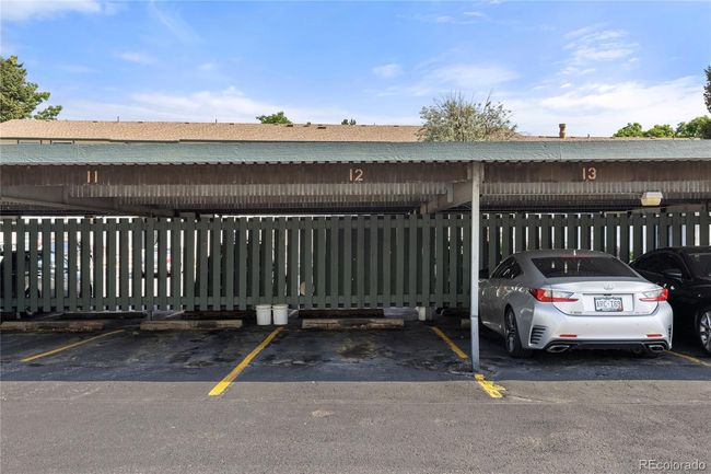 This condo also comes with this covered parking space #12 | Image 24