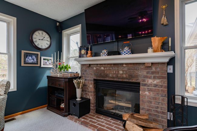 Cozy up to woodburning fireplace and enjoy winter views of Colby Lake.jpg | Image 8