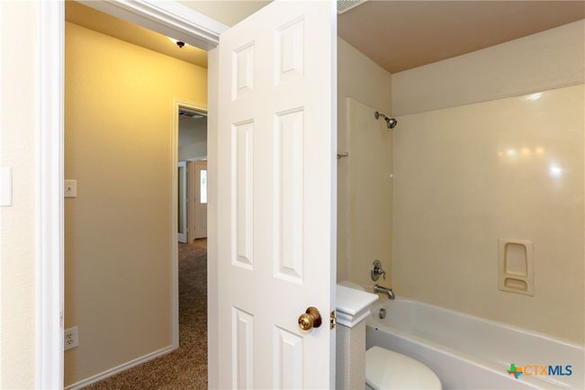 Hall bathroom showing one of the two hallways. | Image 23
