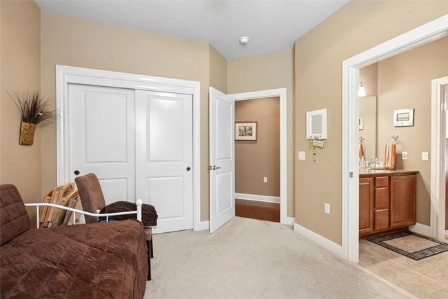 Sitting room with baseboards and light carpet | Image 14