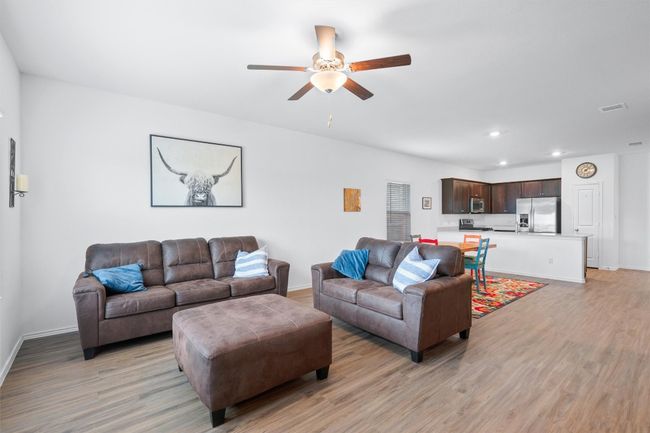Living room with ceiling fan | Image 10