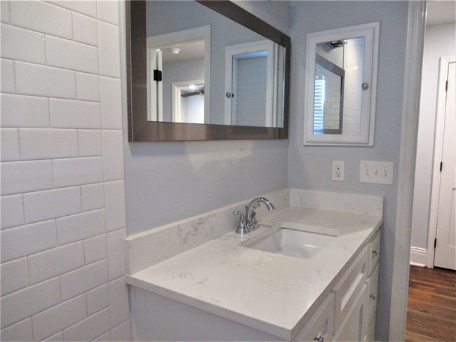 Bathroom with wood finished floors and vanity | Image 14