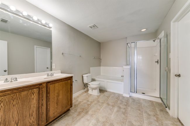Full bathroom with vanity, toilet, and separate shower and tub | Image 21