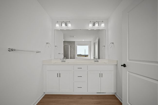 Owners Suite Bath with comfort height vanity and double sinks. | Image 14