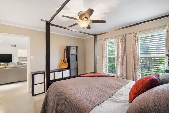 Primary bedroom with walk in closet on main level. | Image 7