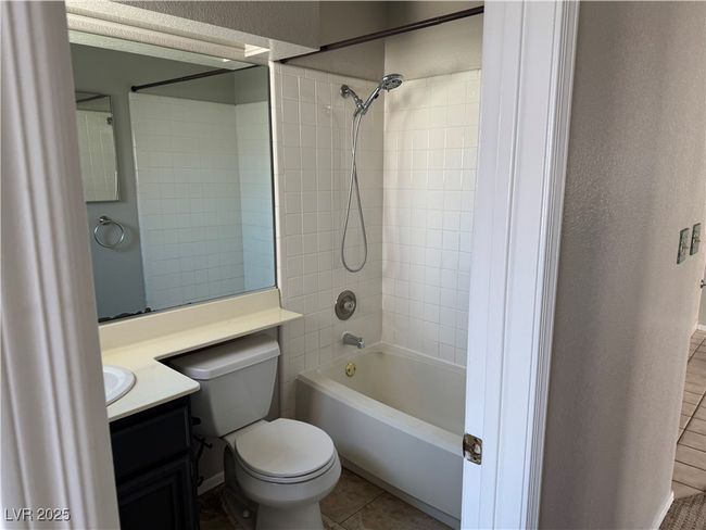 Full bath with vanity, shower combination, and tile patterned floors | Image 7