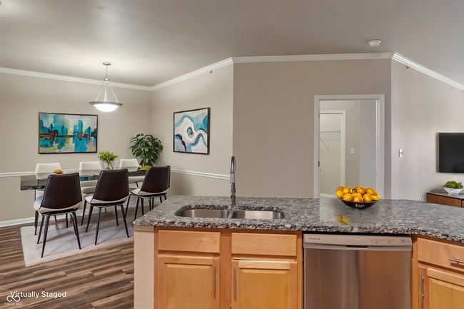 View from the kitchen into the dining room, virtually staged | Image 10