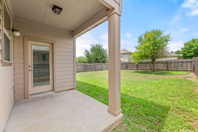 Fenced backyard featuring a patio area | Image 27