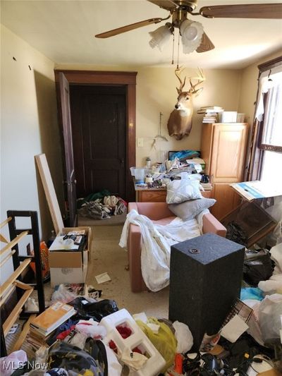 Misc room featuring carpet floors and ceiling fan | Image 3