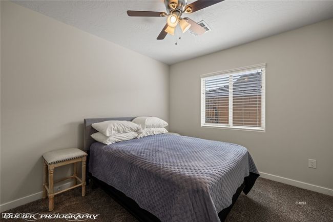 Carpeted bedroom with baseboards and a ceiling fan | Image 35