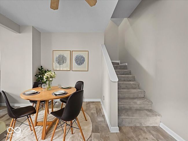 dining space with stairs and baseboards | Image 7