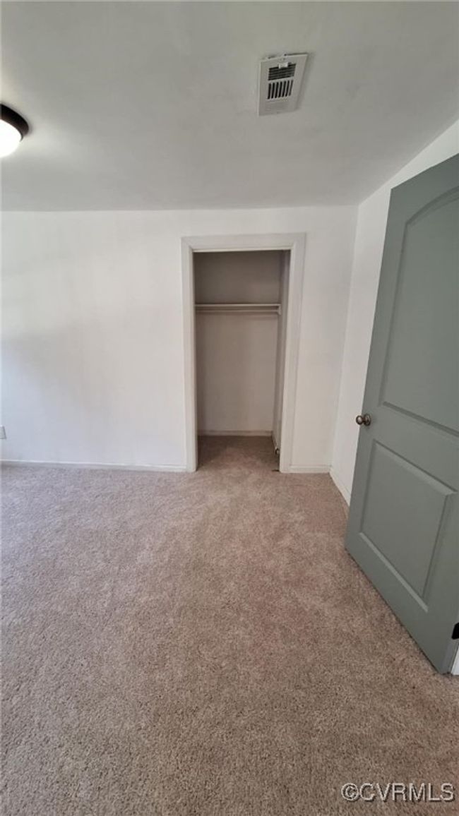 Unfurnished bedroom featuring visible vents, a closet, baseboards, and carpet floors | Image 39
