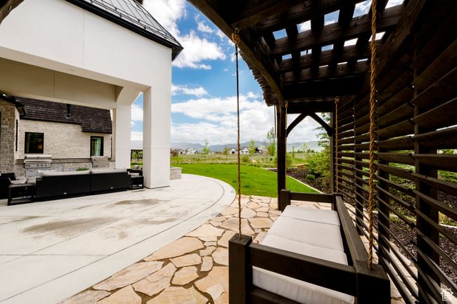 View of patio with an outdoor hangout area, a mountain view, and exterior kitchen | Image 57