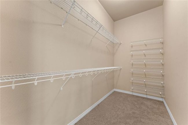 Walk in closet with carpet flooring | Image 44