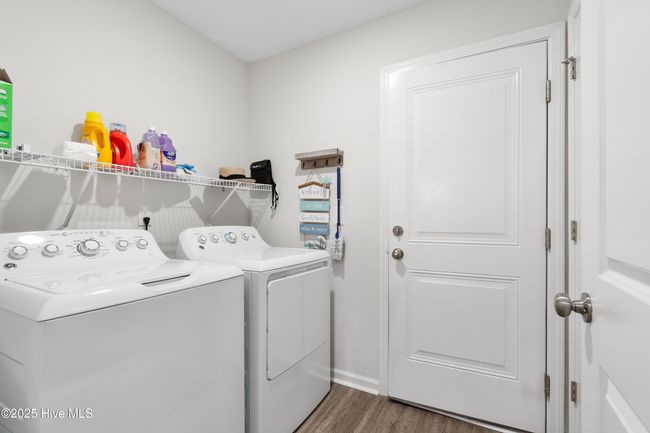 Laundry Room has extra storage closet and door to garage. | Image 21
