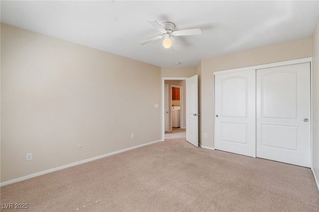 Unfurnished bedroom featuring light carpet, a closet, and ceiling fan | Image 9