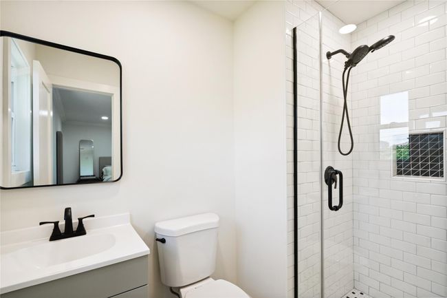 Bathroom featuring a stall shower and vanity | Image 22