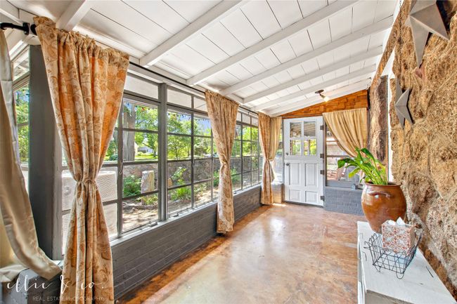 Sunroom with concrete floors and wood ceiling | Image 4