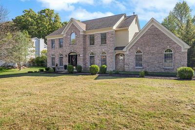 Colonial home featuring a front lawn | Image 2