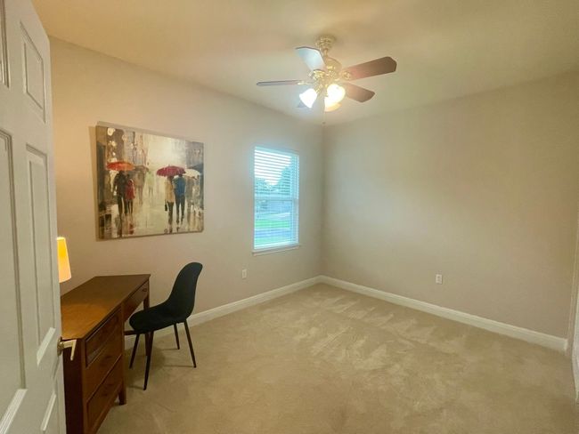 Unfurnished office with light colored carpet and a ceiling fan | Image 17