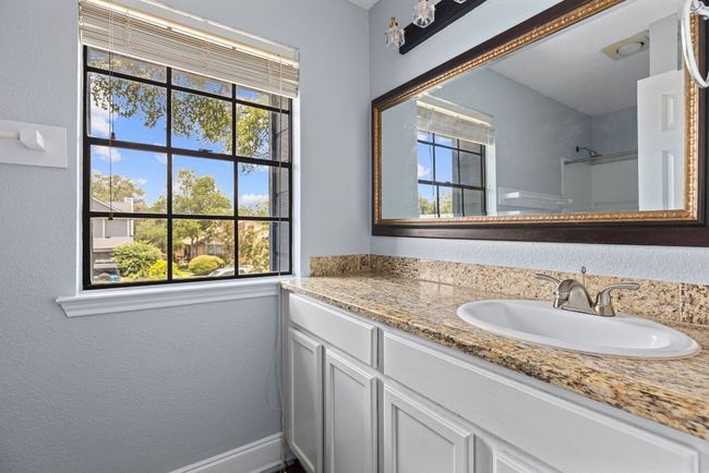 The Shared Full Bath keeps mornings moving smoothly, with a wide vanity, large mirror, and thoughtful finishes throughout. | Image 30