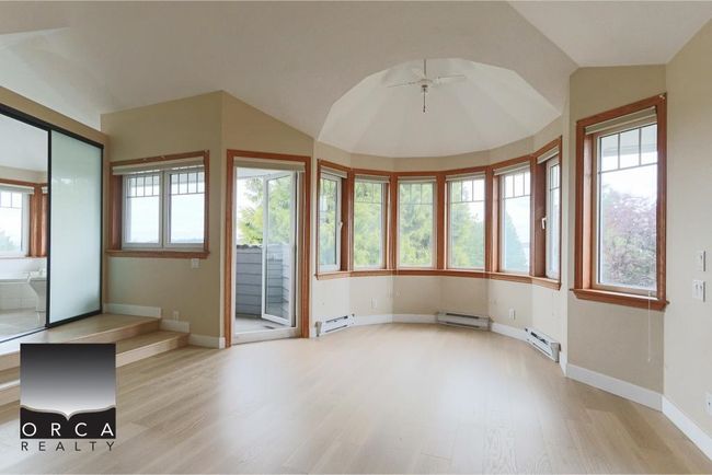 Unfurnished sunroom with a baseboard radiator and a baseboard heating unit | Image 22