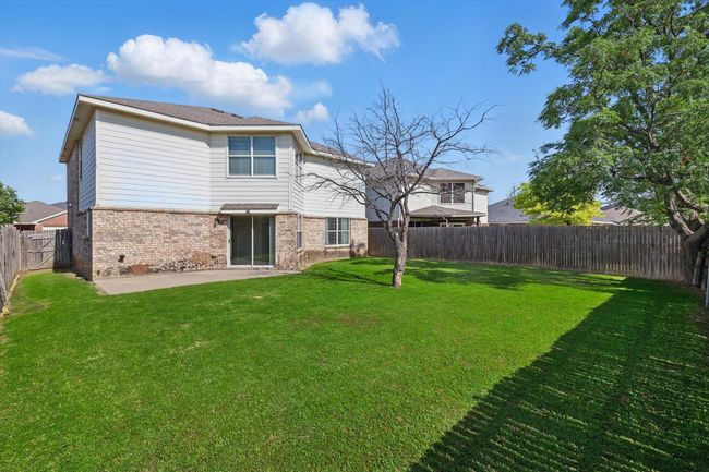 Rear view of property featuring brick siding and a patio area | Image 29