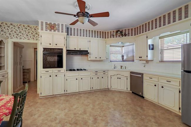 The eat in kitchen is large and has plenty of space for a breakfast table and island, if you wanted. | Image 13