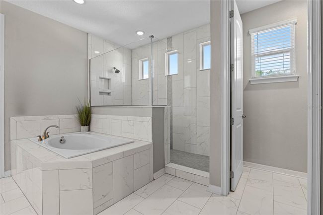 Primary bath, walk-in shower, garden tub, walk-in closet | Image 31