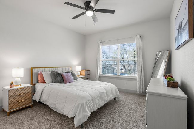 The primary suite features high ceilings, outdoor views and a stylish ensuite. | Image 11
