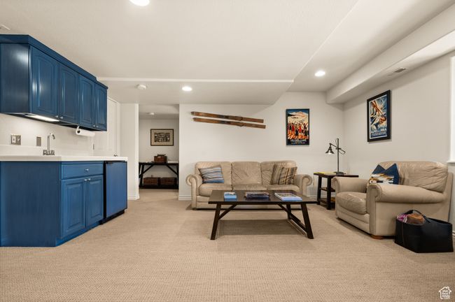 Living room with light colored carpet and recessed lighting | Image 27