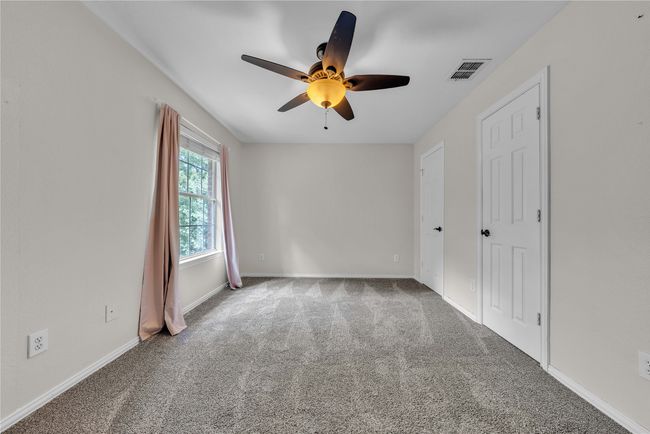 Unfurnished bedroom featuring carpet flooring and a ceiling fan | Image 28