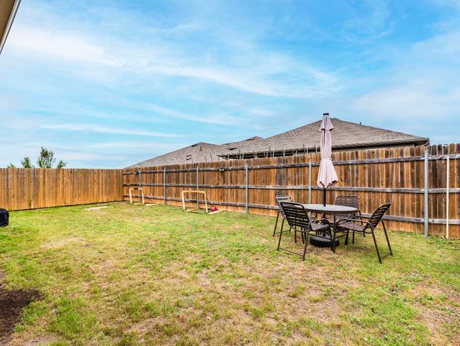 View of yard featuring a fenced backyard | Image 28