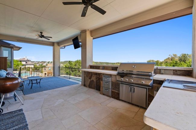 Enjoy Austin’s temperate climate on the covered patio with outdoor kitchen with picture perfect views of Hill Country. | Image 26