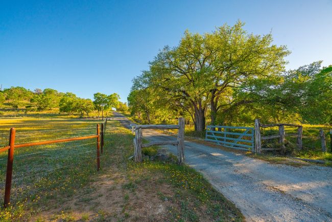 View of gate featuring a rural view and a fenced front yard | Image 33