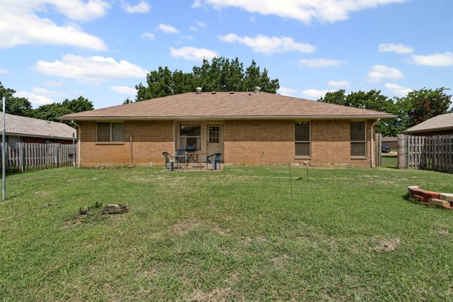 Rear view of property with brick siding and a patio | Image 20