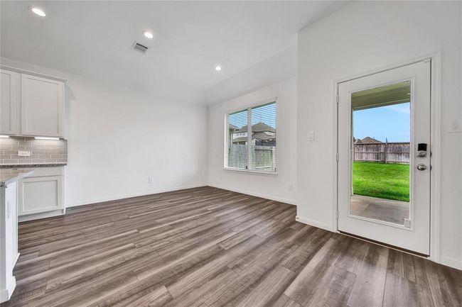 The dining area is a nice size for your family table. | Image 21
