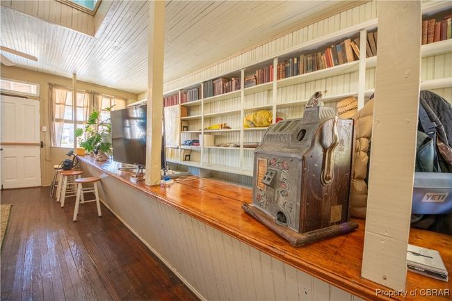 Office space with a skylight and wood-type flooring | Image 24