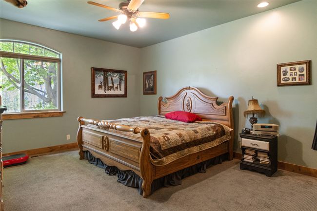 Carpeted bedroom featuring baseboards, recessed lighting, and a ceiling fan | Image 20