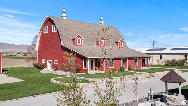 View of front of property with a porch, a shingled roof, a front yard, and a chimney | Image 19