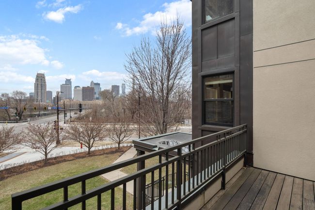 Primary bedroom's private balcony with skyline views | Image 25
